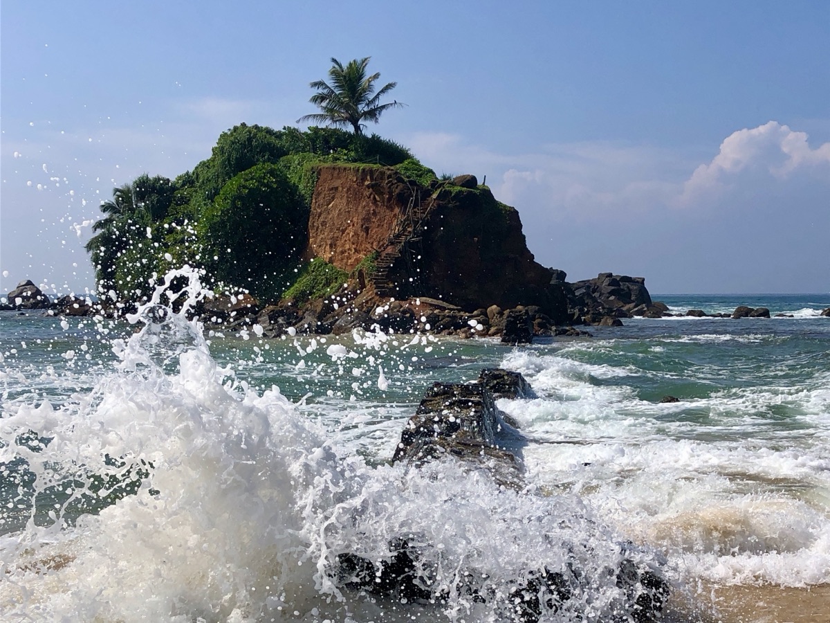 Waves crashing near Parrot Rock at Mirissa Beach